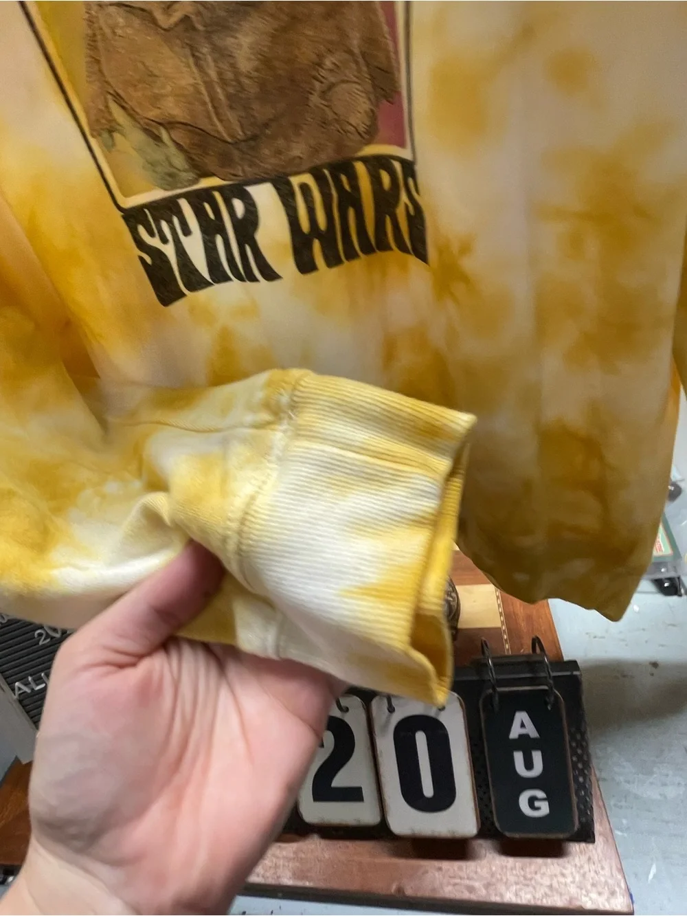 yellow and white tie-dye Star Wars crewneck sweatshirt featuring a retro graphic